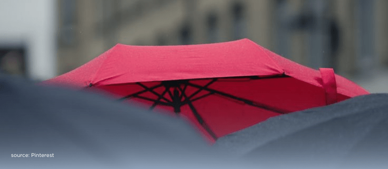 Red umbrella symbolizing India's InsurTech sector growth and innovation amidst digital transformation and emerging opportunities.