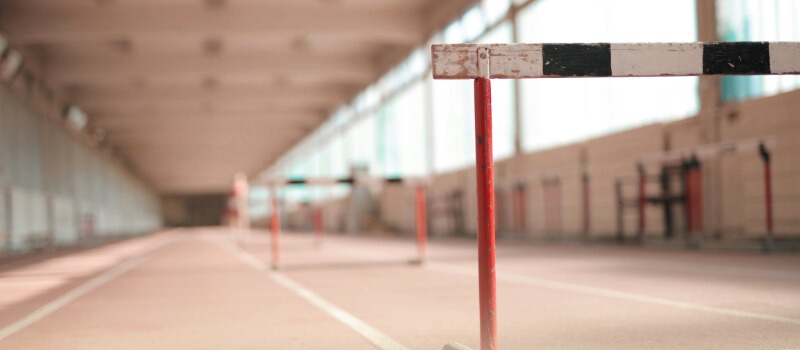 Hurdles on a track, symbolizing the challenges and opportunities for LPs transitioning to GPs in India's private equity market