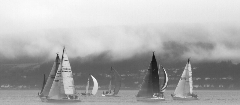 Sailboats in a misty scene, reflecting the focus on navigating towards actual returns (DPI) in the evolving landscape of Indian private markets