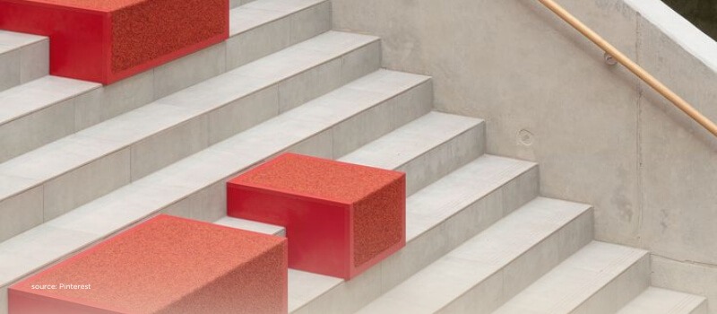 Red blocks on concrete steps, symbolizing timing, access, and structure in secondary investments.