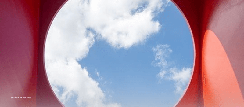 A circular sky view framed by red architecture, illustrating flexibility and strategic exits in private markets.