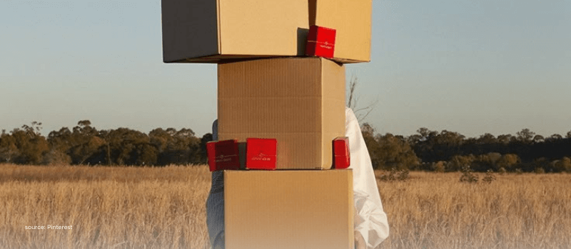 Stack of delivery boxes outdoors, representing India’s rising consumption and e-commerce growth.