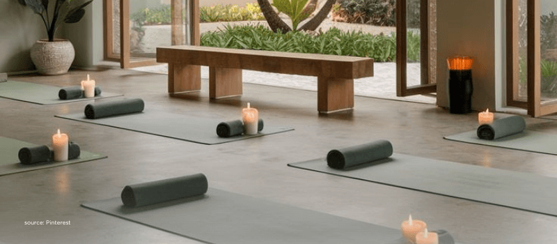 Calm yoga studio with mats and candles, depicting India’s shift toward premium, aspirational lifestyles.