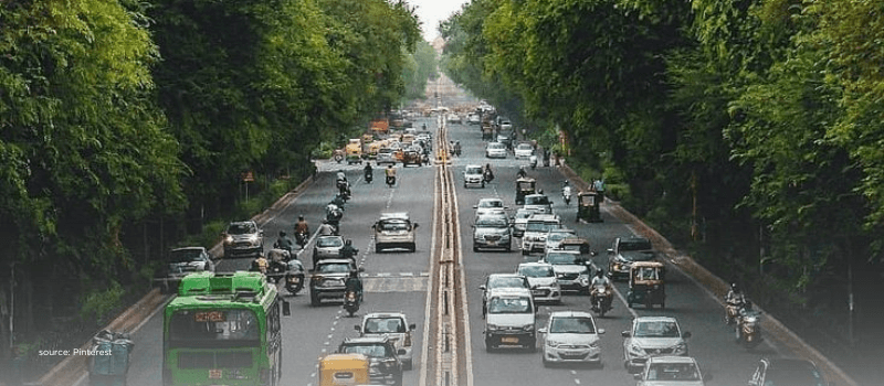 Busy Indian road with cars, buses, and two-wheelers, representing the consumption surge in Tier-II and rural India.
