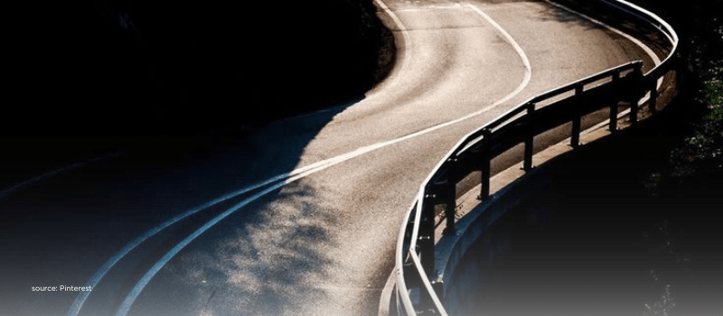 Curving road with guardrails illustrating SEBI LVF reforms lower minimums new flexibility and the need for safeguards.
