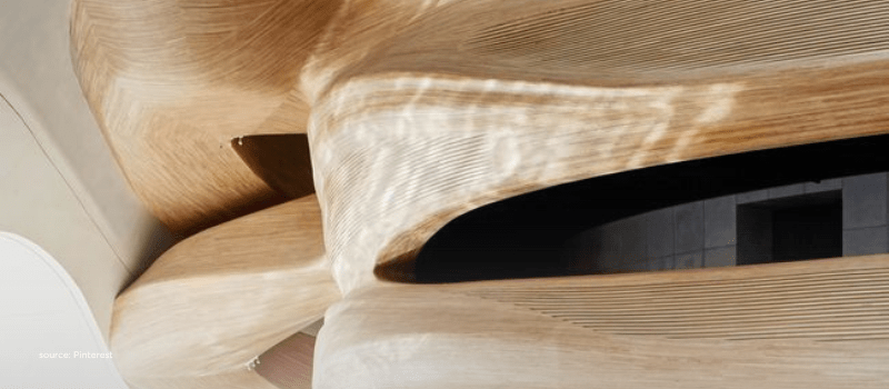 Flowing wood forms evoking the unlocking of India’s $2.7T liquid wealth pool
