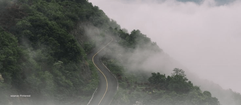 Winding mountain road in fog capturing LP and sovereign funds steering secondaries.