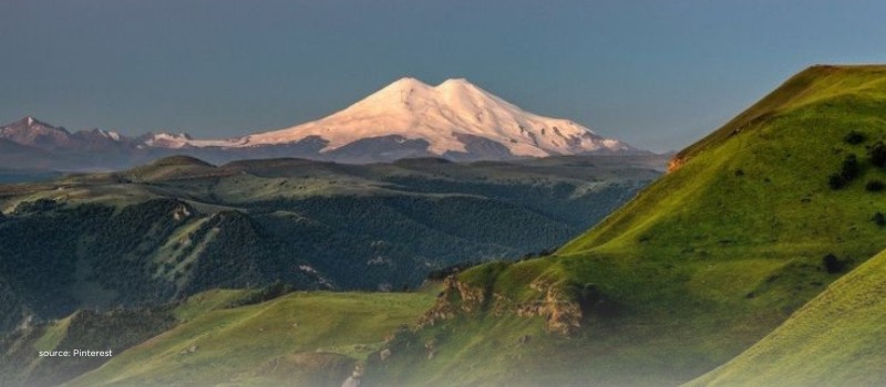 Snow peak above green valleys, signaling a long-horizon AUM growth path