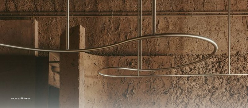 Minimal curved metal lines, echoing focused, conviction-led private investing