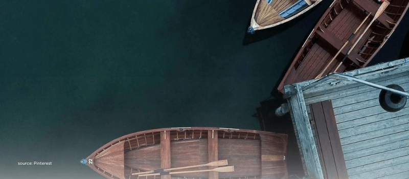 Moored boats at a small dock illustrating shorter, rewired trade corridors