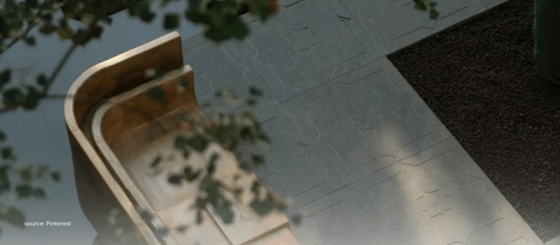 Stone tiles and shadows contrasting asset prices with real-economy foundations