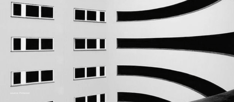 Curved building facade reflecting scale, structure, and long-term institutional confidence in India.