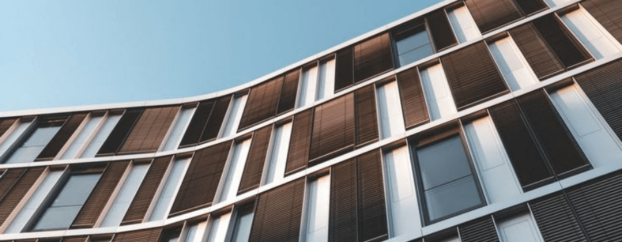 Curved modern building facade, representing India's rising global FDI infrastructure