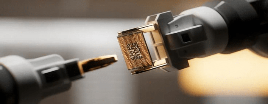 Robotic arms handling a semiconductor chip, representing Korea's chip driven capital boom