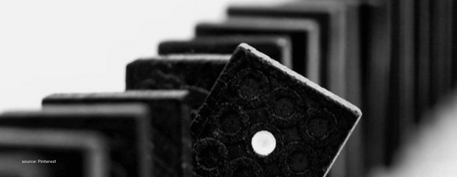 Falling dominoes representing chain reactions in pre IPO listing and lock in cycles