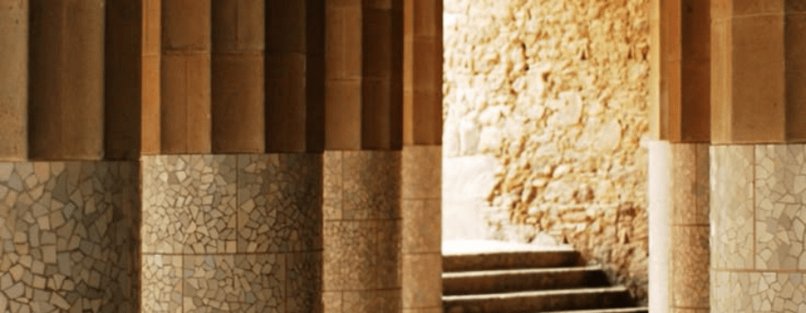 Sunlit stone pillars and steps, representing the structural foundations of state competitiveness